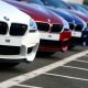 Poland: Driver collides with a BMW at a vehicle dealership.