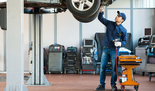 Portrait of a mechanic at work in his garage