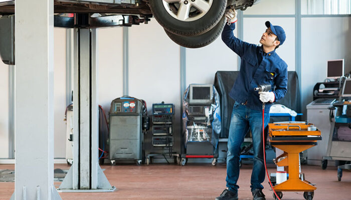 Portrait of a mechanic at work in his garage